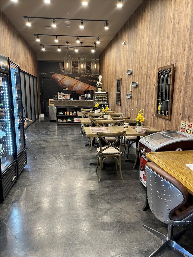 recreation room featuring wooden walls