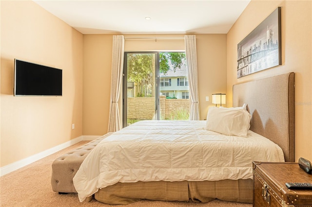 bedroom featuring access to exterior, carpet, and baseboards