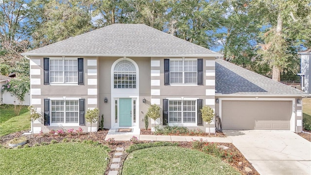 view of front of property with a front lawn and a garage