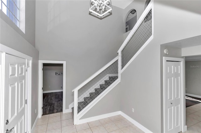 stairway with tile patterned flooring