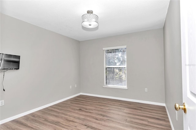 empty room featuring hardwood / wood-style flooring