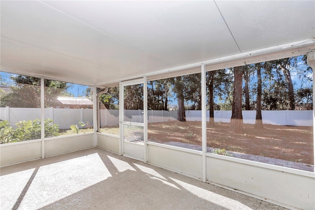 unfurnished sunroom with a wealth of natural light