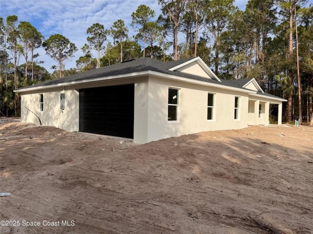 view of property exterior with a garage