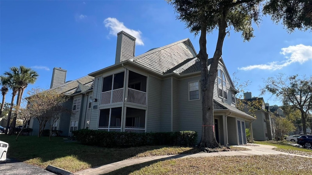 view of side of property with a yard