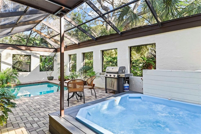 view of swimming pool featuring a lanai, area for grilling, and a patio area