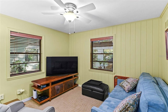 living room with ceiling fan and light colored carpet