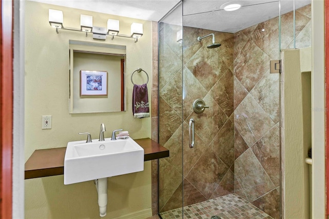 bathroom with a shower with shower door