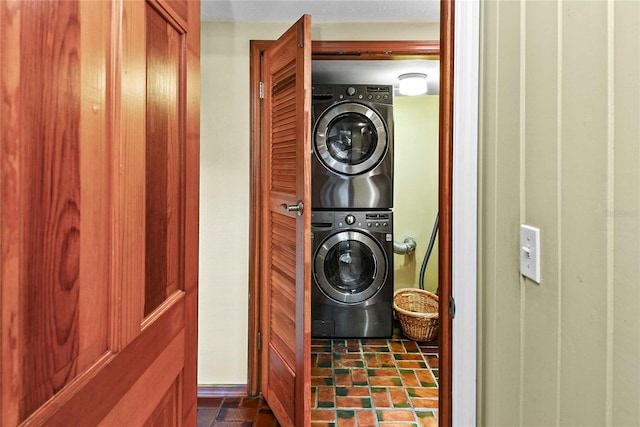 laundry room with stacked washer / dryer