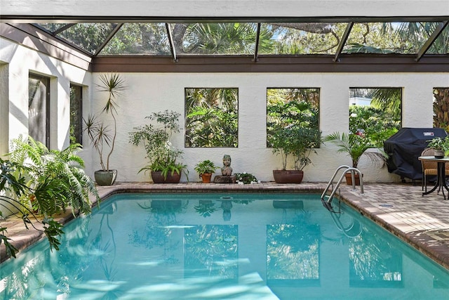 view of swimming pool with area for grilling and a patio area