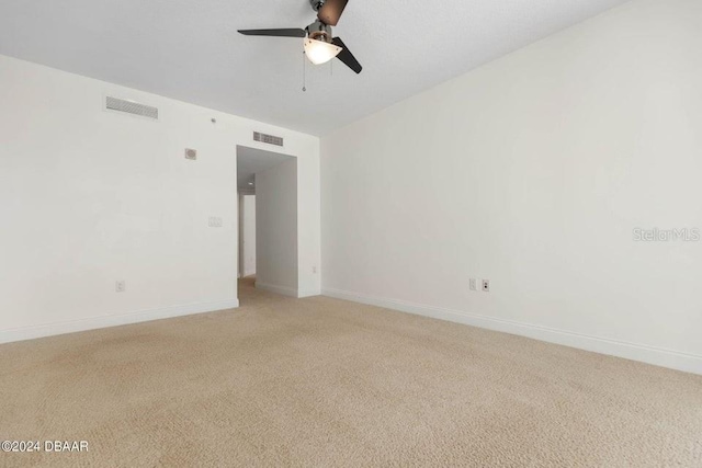 empty room featuring carpet and ceiling fan