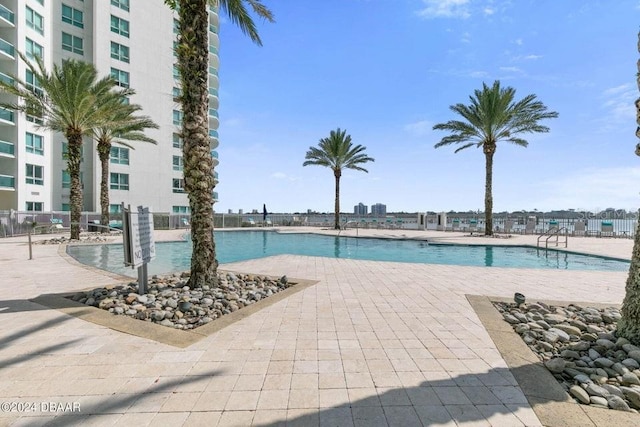 view of pool featuring a patio