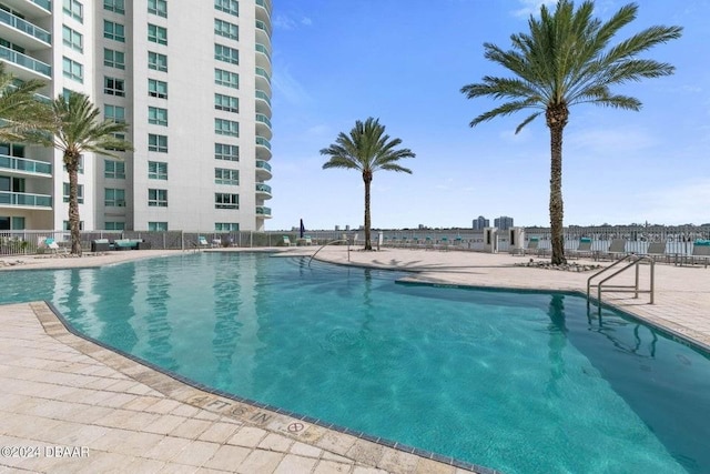 view of swimming pool featuring a patio area