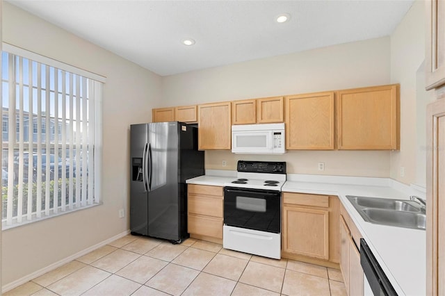 kitchen featuring black fridge with ice dispenser, sink, light brown cabinets, and electric stove