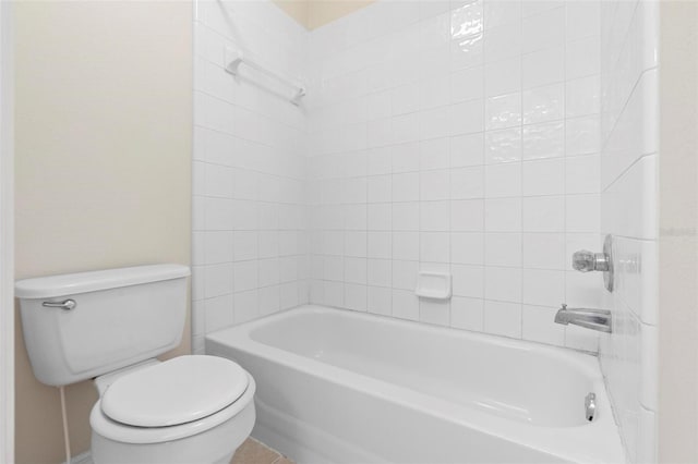 bathroom featuring tile patterned floors, shower / tub combination, and toilet