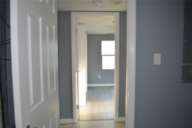 corridor with light tile patterned floors