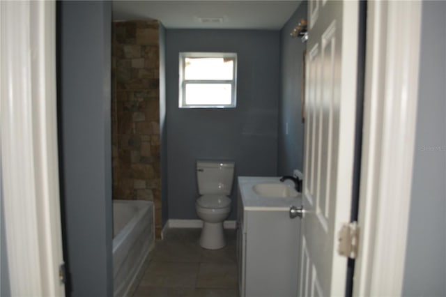 full bathroom featuring toilet, tile patterned flooring,  shower combination, and vanity