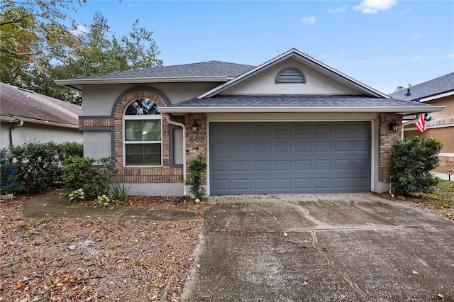 single story home with a garage