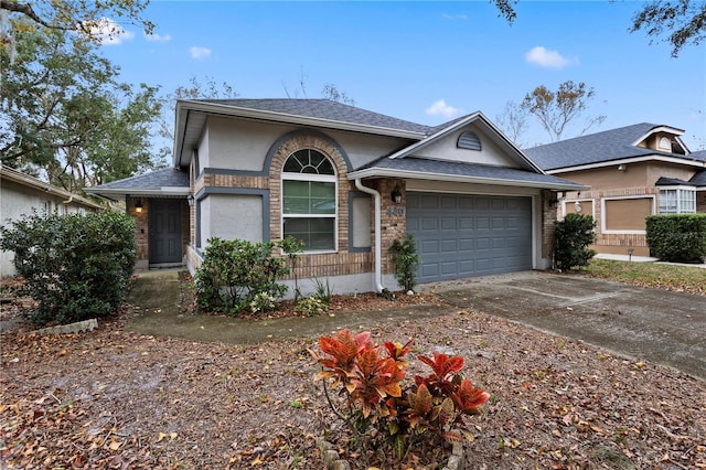 ranch-style house featuring a garage