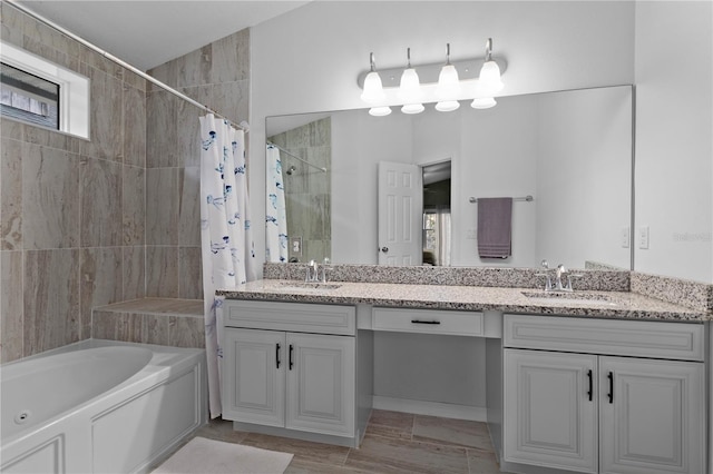 bathroom featuring shower / tub combo with curtain and vanity