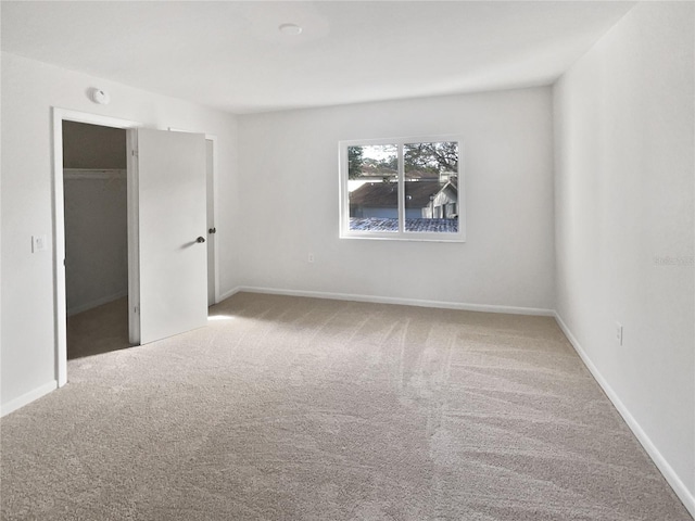 unfurnished room featuring carpet flooring