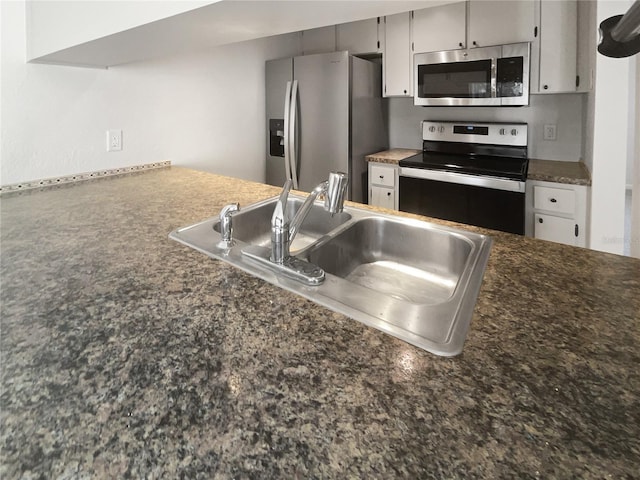 kitchen featuring gray cabinets, sink, and stainless steel appliances