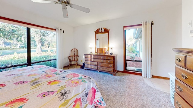 carpeted bedroom with ceiling fan and multiple windows