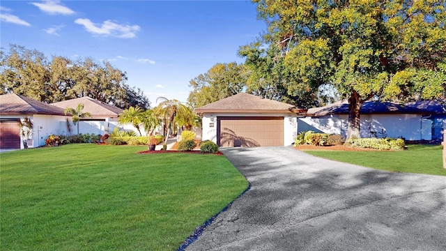 view of front facade featuring a front lawn and a garage