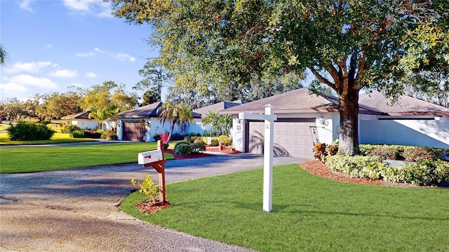 ranch-style home with a front lawn and a garage