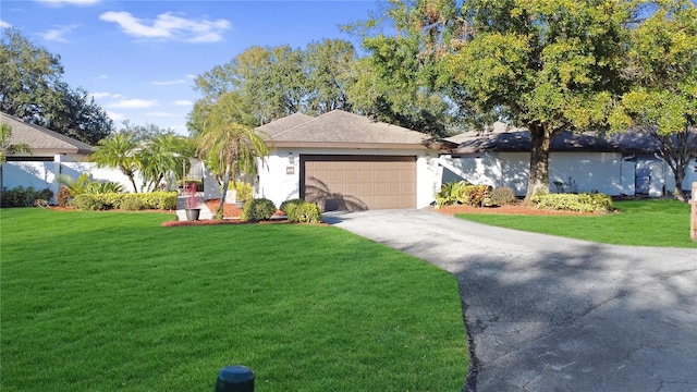 view of front of house featuring a garage and a front yard