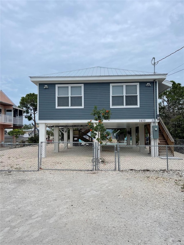 view of front of home featuring a carport