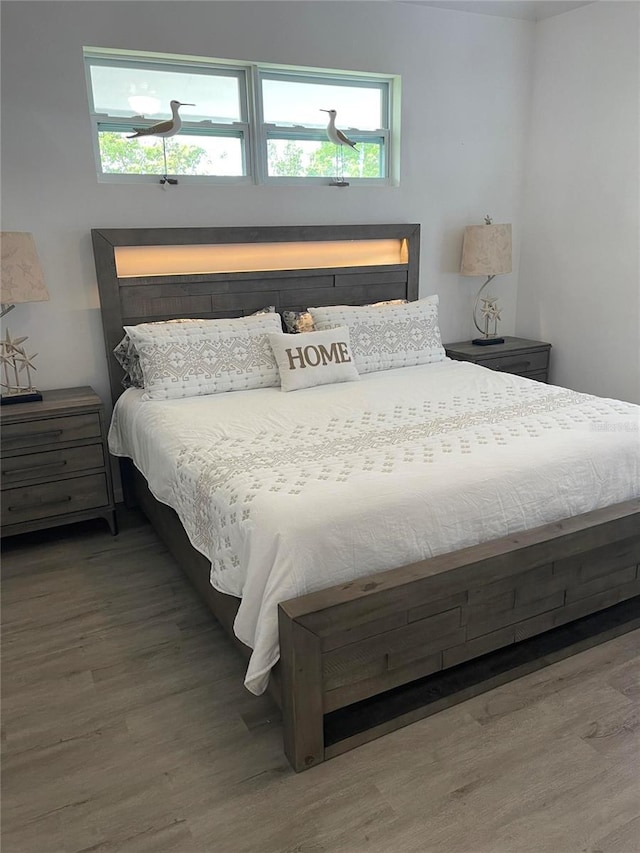 bedroom with wood-type flooring