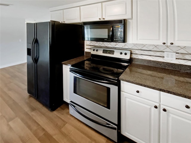 kitchen featuring decorative backsplash, white cabinetry, dark stone countertops, and black appliances