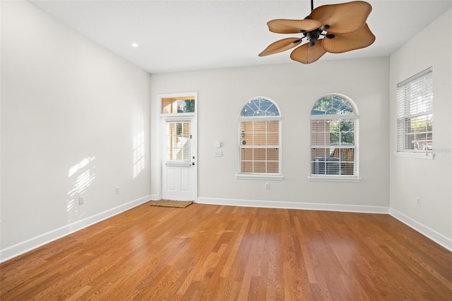 spare room featuring ceiling fan and hardwood / wood-style flooring