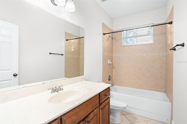 full bathroom featuring tile patterned floors, vanity, toilet, and tiled shower / bath