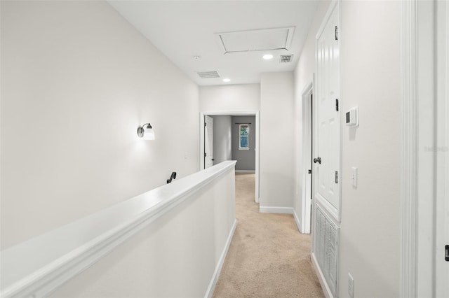 hallway with light carpet