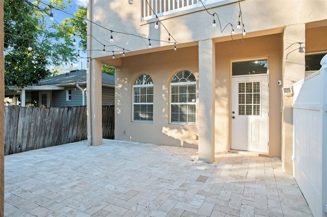 property entrance with a patio area