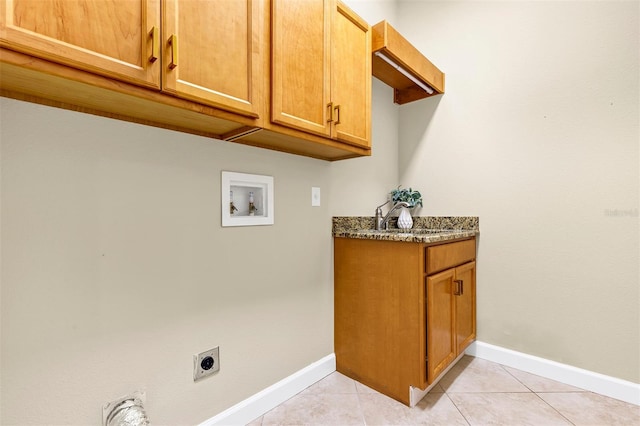 washroom with hookup for a washing machine, sink, electric dryer hookup, and light tile patterned flooring