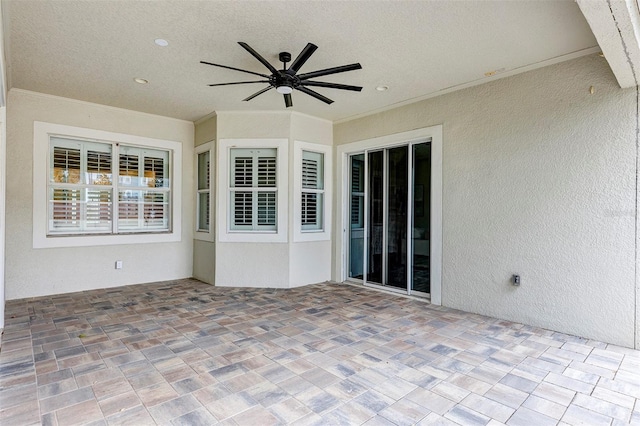 view of patio featuring ceiling fan