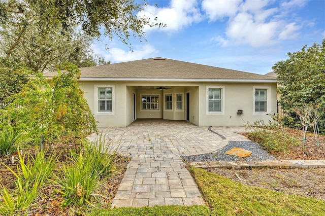 back of property featuring a patio and ceiling fan