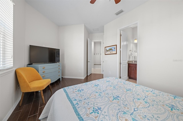 bedroom featuring ensuite bathroom and ceiling fan