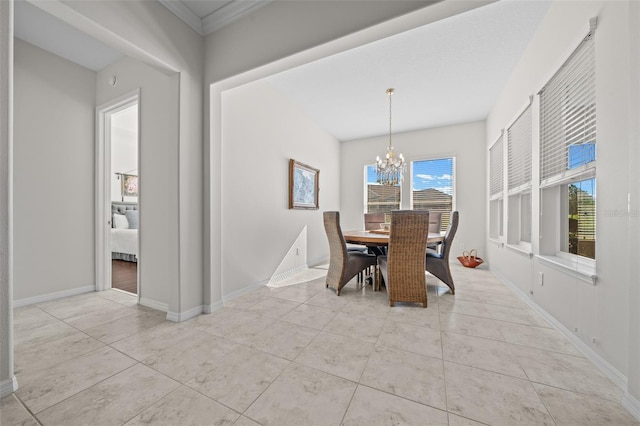 tiled dining room with crown molding and an inviting chandelier