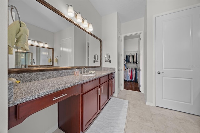 bathroom featuring tile patterned floors and vanity