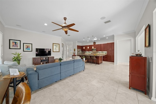 tiled living room featuring ceiling fan and ornamental molding