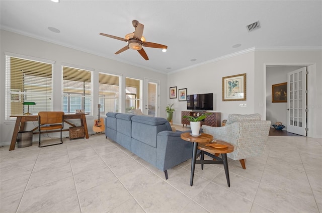 tiled living room with ceiling fan and ornamental molding