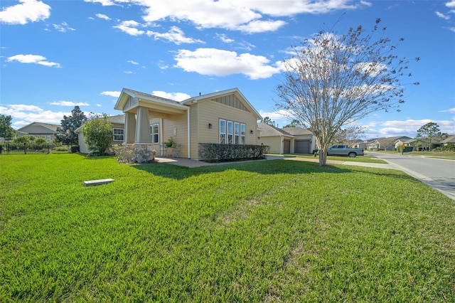 view of property exterior featuring a garage and a lawn