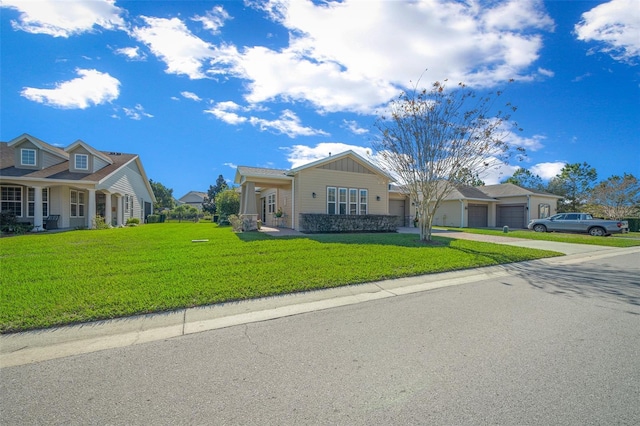 view of front of house with a garage and a front lawn