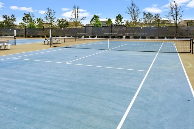 view of sport court featuring basketball hoop