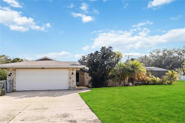 view of front of property featuring a garage and a front yard