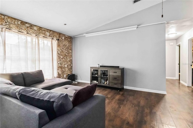 living room with dark hardwood / wood-style flooring and vaulted ceiling