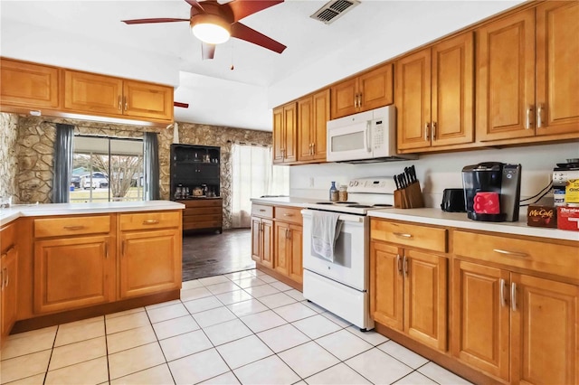 kitchen with white appliances, ceiling fan, and light tile patterned flooring